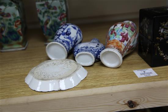 A pair of Chinese famille rose celadon ground vases, two blue and white vases and a spoon tray, all Qing dynasty